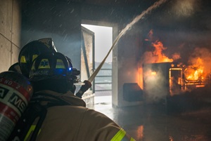 Beau, bariatric patient, putting out a fire
